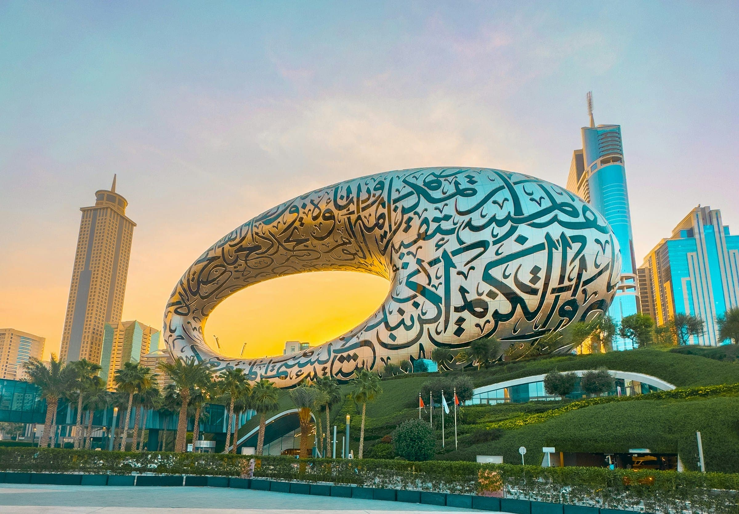 The Museum of the Future in Dubai at golden hour, its facade written in Arabic calligraphy